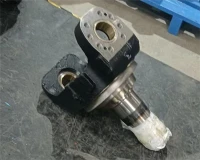 How does a steering knuckle interact with the tie - rod end?